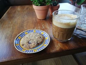 Chocolate chip cookie and cappucchino at Cantinho do Mercado in Vila Nova De Milfontes