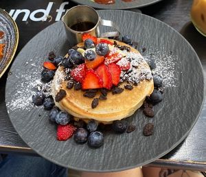Oreo heaven pancakes with extra added strawberries and blue berries😍  at Mr NonNo - Center in Rotterdam