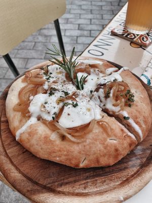 Focaccia Toscana with onions and vegan cheese  at Amaranto Bistrot in Finale Ligure