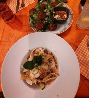 Fennel salad with apple splices, olives, zucchini, raisins, bread crumbs (=bottom)

Falafel with yoghurt and Ligurian herbs (=top) at Amaranto Bistrot in Finale Ligure