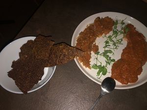 Romanian starter - Zacusca with Serbian ajvar. Came with homemade seed crackers  at Verv Kitchen in Bucharest