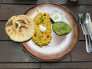 Tofu scramble plate, arepa con queso  at AMA in Medellin