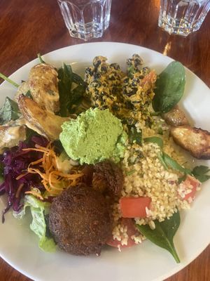 Potato wedges, black beans, falafel, hummus, salad, bulgur...  at Cafe Hangmattan in Gothenburg