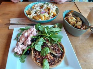 Mediterranean tart, salad & Bubble & Squeak. Behind is the Tropical Fries. at The Bay Vegan Deli Coffee House in Sandown
