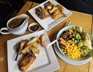Sunday lunch, veggies, huge gravy boat and cranberry sauce at The Bay Vegan Deli Coffee House in Sandown