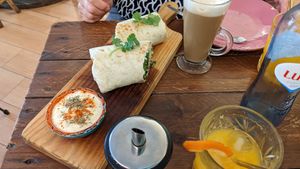 Wife's vegan burrito and almond milk latte... She approves 😁 at Break Sé in Lisbon