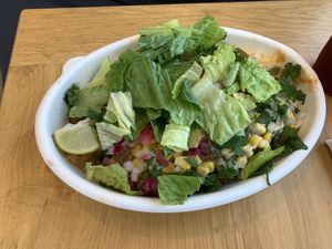 Bowl topped with vegan chicken  at Plantos in Riverside