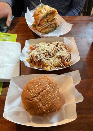 Satifaction Burger (top), loaded fries, and hot stuff burger  at Next Stop Vegan - Washington Heights in New York City