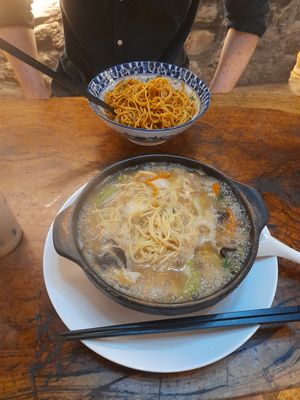Mushroom broth in a casserole pot with vegetables and noodles - 20rmb, vegan at Shi Zhiqian - 释之谦 - Maybe closed in Dali
