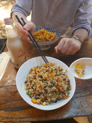 Front: 菌王炒饭 jùn wáng chăo fàn - a fried rice with a variety of chopped up vegetables in it including sweetcorn, carrot and celery. Absolutely delicious. 20rmb

Back:  at Shi Zhiqian - 释之谦 - Maybe closed in Dali