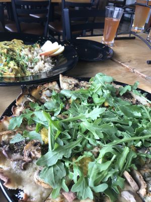 Mushroom flatbread and yellow curry with a kombucha flight!  at Julia's Vegetarian Restaurant in Pacific Grove