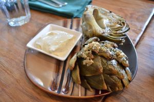 super delicious Roasted Artichoke  - Roasted globe artichoke served with a vegan garlic & lemon aioli at Julia's Vegetarian Restaurant in Pacific Grove