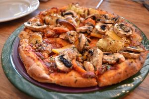 Julia’s Pizza - vegan on request - Roasted vegetables, mozzarella, mushrooms. at Julia's Vegetarian Restaurant in Pacific Grove