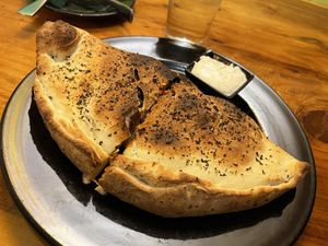 Calzone with vegan cheese   at Julia's Vegetarian Restaurant in Pacific Grove