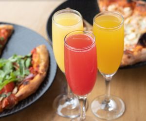 Mimosas: orange, mango or strawberry! at Julia's Vegetarian Restaurant in Pacific Grove