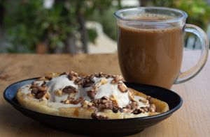 Vegan banana split with caramelized bananas, dairy free ice cream, candy cap caramel sauce, walnuts and a cup of coffee. at Julia's Vegetarian Restaurant in Pacific Grove
