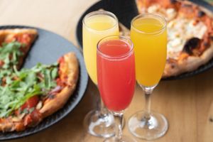 Choose your flavor mimosas! Orange, strawberry, or mango at Julia's Vegetarian Restaurant in Pacific Grove