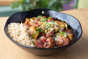 Vegan Faux Orange Chicken with crispy cauliflower and veggies in a sweet and tangy Asian sauce, served with rice at Julia's Vegetarian Restaurant in Pacific Grove