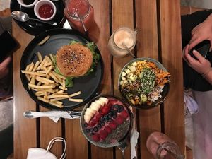Burger, poke bowl and acaí bowl at Fat Rabbit in Playa Del Carmen