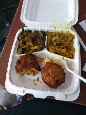 Crab cakes, collard greens, and coconut curry cabbage at The Land of Kush in Baltimore