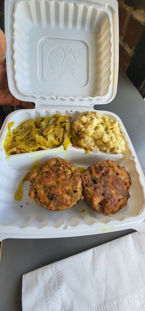 Potato salad, coconut curry cabbage, crab cakes at The Land of Kush in Baltimore