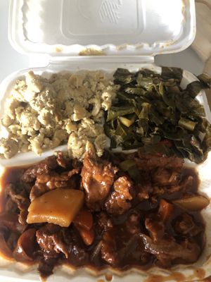 Mac and cheese, collards, and BBQ “ribs"  at The Land of Kush in Baltimore