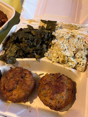 Crab cakes, collard greens and seafood Mac n cheese  at The Land of Kush in Baltimore
