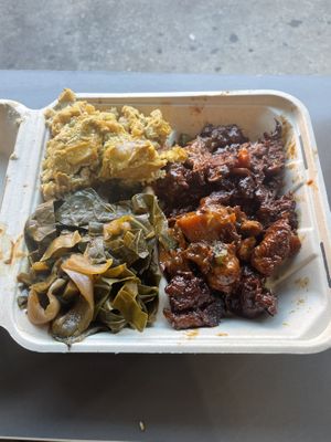 mac n cheese, collards, ribs  at The Land of Kush in Baltimore