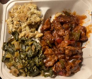 Collards, mac, & bbq ribs. Fantastic!  at The Land of Kush in Baltimore