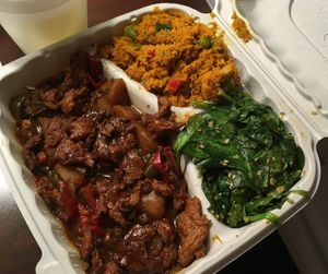 BBQ rib platter! Ribs, carrot salad, and sesame spinach.  at The Land of Kush in Baltimore