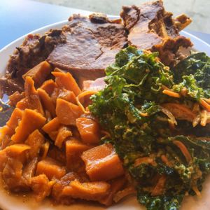 Eggplant parm with candied yams & Kale salad at The Land of Kush in Baltimore
