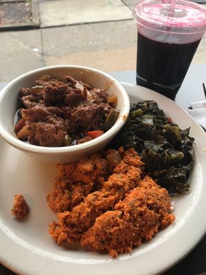 BBQ ribs, collard greens, carrot tuna salad and sorrel drink at The Land of Kush in Baltimore