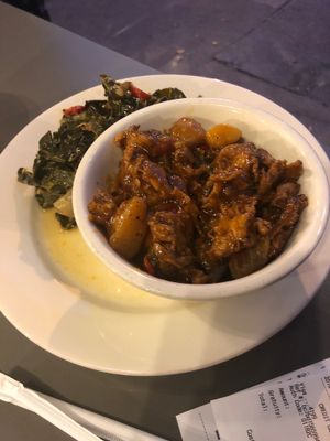Collard greens and meat  at The Land of Kush in Baltimore