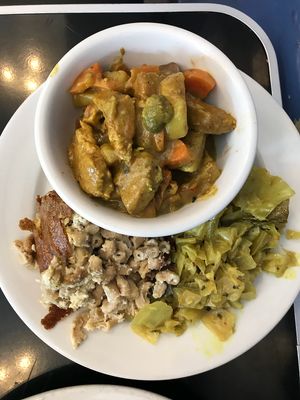 Coconut Chicken Curry with Curry Cabbage and Mac and Cheese at The Land of Kush in Baltimore