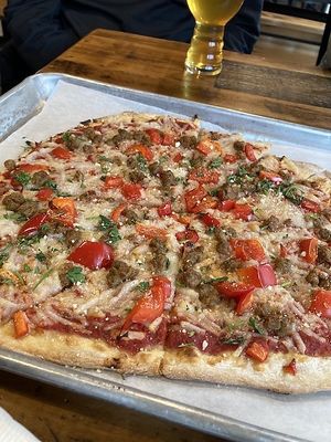 Red pepper sausage vegan pizza at Saucy Brew Works in Shaker Heights