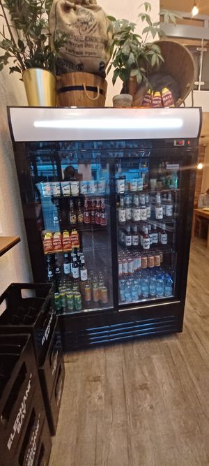 Drinks and indoor seating behind at CHUMPIRS in Basel