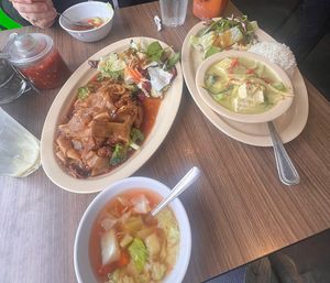 ** lunch orders come with a side salad. We ordered pad sew with mock duck on the left, and green curry with tofu on the right. Ask for vegan   at Thai Elephant of Morro Bay in Morro Bay