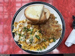 Tofu scramble with leak and potato, with hash potato cake and sourdough toast  at Bouldin Creek Cafe in Austin