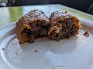 Savory kolach (vegan) filled with cheese, chorizo and tomato. at Bouldin Creek Cafe in Austin