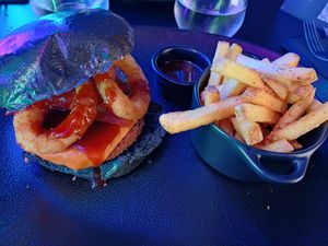 Black BBQ burger and fries at Guakame Street Food in Valencia
