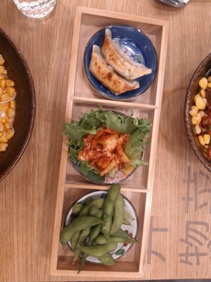 Starter combo with vegan gyoza, kimchi and edamame at Momotoko - Citycenter in Helsinki