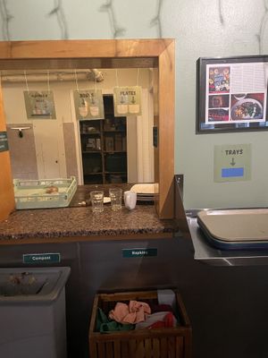 Sort plates and utensils after eating   at Casa de Luz in Austin