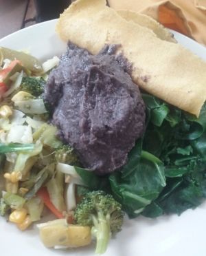 Vegan breakfast sautéed vegetables, bean puree, greens, and handmade tortillas. at Casa de Luz in Austin