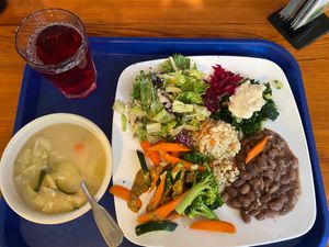 Lunch on Nov 2, 2023: Miso soup, garden greens, rice, pinto beans, mixed veggies, kale and pickled beets. Also hibiscus tea at Casa de Luz in Austin