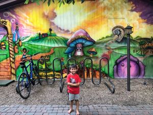 Wall art and one of our favorite community members. at Casa de Luz in Austin