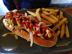 Hotdog and chips (March 2024) at Radcliffes Cafe Bar in Morpeth