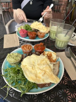 Vegetarian breakfast in front of me and my friend with the vegan breakfast that came with an egg as well and had to be removed!  at Leafwild Café in West London