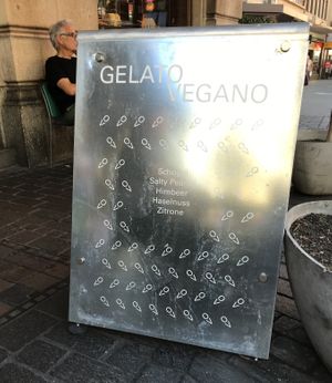Sat outside by this advertising board😄  at Gelato Vegano in Basel