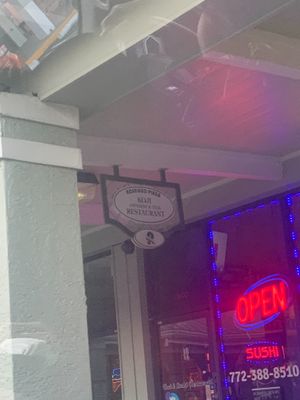 Sign outside restaurant at Koji Japanese & Thai Restaurant in Sebastian