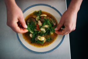 Harissa Spiced Potatoes with Haricot beans and Lemon Broth at Venn Canteen in Porto